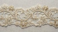 Elegant ivory and gold floral embroidered lace trim with intricate beaded details on linen, perfect for bridal, fashion, and luxury textile design.