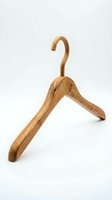 Wooden bamboo clothes hanger isolated on white background, eco-friendly wardrobe accessory for sustainable fashion storage and retail display.