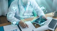 Medical professional using laptop with digital health checkup interface and glowing healthcare icons for telemedicine and modern medical technology applications.