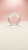 Clear glass sphere on soft pink and white background, isolated for design use on packaging, web graphics, and marketing materials.
