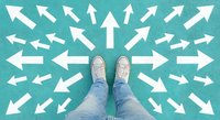 Person in sneakers surrounded by white directional arrows on turquoise background representing choice, decision making, career path selection and life direction concepts.