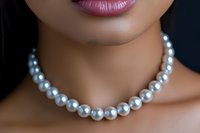 Close up of elegant pearl necklace on African American woman's neck, pink lipstick, smooth skin, dark background, luxury jewelry fashion detail.