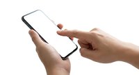 Hands holding smartphone with blank white screen for mockup and app presentation on isolated white background.