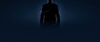 Silhouette of male figure standing against dark blue background with dramatic lighting effect, suitable for business, technology, leadership, and corporate design projects.