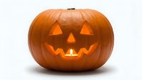 Halloween jack-o-lantern pumpkin with glowing carved face isolated on white background for autumn holiday decorations and seasonal design projects.