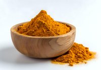 Vibrant orange turmeric powder in wooden bowl on white background, popular spice used in cooking, natural medicine, and skincare products.