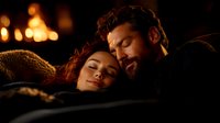 Romantic couple relaxing together in cozy evening atmosphere with warm lighting and soft blanket, expressing intimacy and tenderness in peaceful moment.