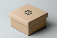 Square beige cardboard gift box with floral logo on lid against neutral background, minimalist packaging design for retail and branding presentations.