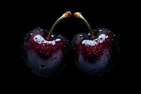 Fresh dark red cherries with water drops on black background, dramatic lighting highlights glossy skin and natural moisture for food photography and design.