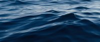 Deep blue ocean waves with gentle ripples creating natural water texture patterns for marine and nautical themed designs and backgrounds.
