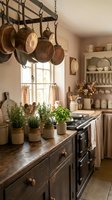 Rustic farmhouse kitchen interior with hanging copper pots, herb plants, vintage stove and country style decor for cozy home design inspiration.