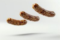 Grilled sausages floating in air on white background, juicy bratwurst with crispy brown crust showing delicious grill marks and appetizing texture.