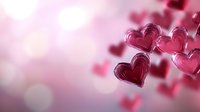 Pink and red layered heart shapes floating on blurred romantic background with bokeh lights, creating dreamy Valentine's Day atmosphere for greeting cards and romantic designs.