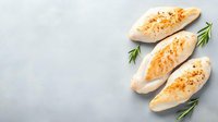 Grilled chicken breasts with golden crust and fresh rosemary sprigs arranged on light gray background, top view. Food photography for menu and recipes.