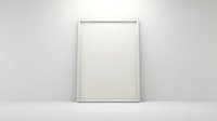 Empty white frame leaning against minimalist wall on wooden floor, ready for artwork display in modern interior design mockup.