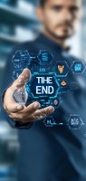 Businessman touching futuristic holographic interface with "THE END" text displayed among digital hexagonal icons, representing conclusion of business project.