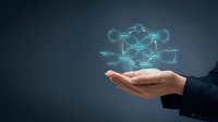 Business hand presenting glowing network connections with digital nodes and links floating above palm for technology and connectivity concepts.