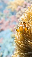 Clownfish nestled within golden anemone tentacles in tropical coral reef environment. Underwater marine life scene suitable for nature, wildlife, and ocean conservation content.