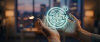 Hands holding glowing digital circuit board symbol against blurred city skyline at dusk, representing technology innovation and digital transformation for business solutions.