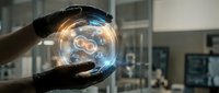 Hands protecting glowing digital infinity symbol with futuristic holographic interface in modern office environment for technology concepts.
