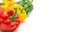 Fresh colorful bell peppers red yellow green isolated on white background for healthy cooking recipes menu design culinary presentations food blogs.