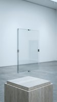 Modern minimalist glass panel display stand on concrete pedestal in contemporary gallery space for product presentation and exhibitions.