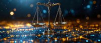 Scales of justice on glowing blue and gold bokeh background, symbol of law and legal system in dramatic lighting with defocused city lights.