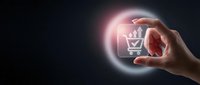 Hand holding glowing virtual shopping cart icon with upward arrows on dark background, symbolizing e-commerce growth and online sales increase.