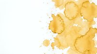 Abstract golden yellow watercolor stains and splatters on white background. Organic paint drops and blots for artistic design projects and creative layouts.