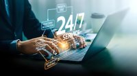 Professional using laptop with glowing 24/7 service interface displaying customer support icons and digital connectivity elements for business solutions.