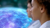 Young African American woman in white coat looking at glowing blue holographic sphere with cosmic elements, representing future technology and innovation.