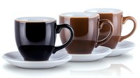 Three coffee cups in gradient colors from black to light brown on white saucers arranged in row against white background, minimalist beverage composition.