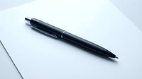 Black ballpoint pen isolated on white paper background, ready for design mockups, stationery graphics, and office supply illustrations.