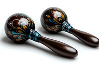 Pair of decorative wooden maracas with colorful floral patterns and beaded handles for music and rhythm instruments on white background.