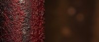 Close-up of weathered red brick wall texture with rough surface and natural aging patterns. Architectural background for construction and design projects.
