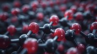 Molecular structure visualization showing red and black atoms connected by bonds in close-up macro view, illustrating chemical compound or carbon structure.