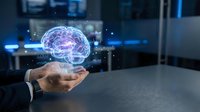 Businessman hand holding holographic brain with neural network connections in modern office environment representing artificial intelligence and innovation.