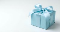 Light blue gift box with satin ribbon bow on white background, perfect for holiday, birthday, and celebration concepts.