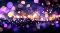 Magical glowing bokeh lights in purple and gold colors creating dreamy abstract background with sparkling particles and blurred circles effect.