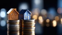 Miniature houses on stacks of coins representing real estate investment, property market growth, mortgage planning and housing finance concepts.