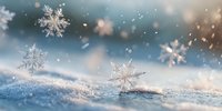 Delicate snowflakes falling on sparkling snow surface with soft bokeh lights creating magical winter atmosphere for seasonal holiday designs.