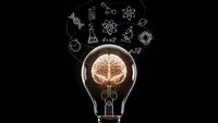 Light bulb with glowing brain inside surrounded by science icons on black background. Creative thinking, innovation, education and research concept.