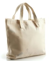 Blank beige cotton tote bag with handles isolated on white background, ready for custom design and branding use in retail and promotional projects.