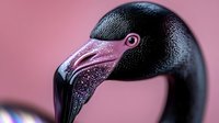 Close-up portrait of plastic pink flamingo head with detailed black beak and eye against soft pink background for tropical summer decor concepts.