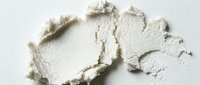 Crushed white powder texture on isolated background, suitable for cosmetics, makeup, skincare product design, and beauty packaging mockups.