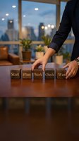 Business professional arranging wooden blocks spelling Start Plan Work Check Win on office desk. Strategic planning and goal achievement concept for corporate success.