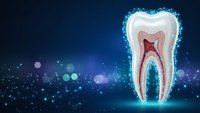 Digital tooth anatomy cross-section with glowing particles on blue background for dental healthcare and medical education presentations.