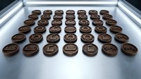 Rows of chocolate cookies with cream filling arranged on white surface under bright studio lighting, suitable for food photography and bakery marketing.