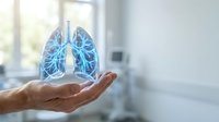 Male hand holding glowing blue lungs hologram in modern medical office environment for healthcare and respiratory system concepts.