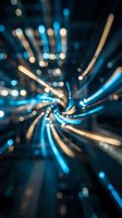 Abstract blue and gold light trails creating dynamic spiral motion blur effect with bokeh particles on dark background for modern digital designs.